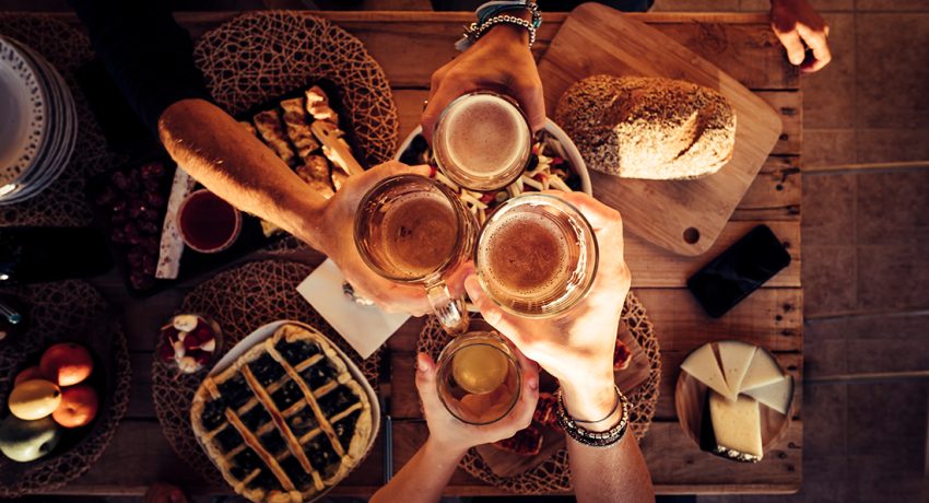 people-eat-mixed-meals-at-festive-table-served-for-2023-11-27-05-29-46-utc